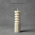 Hybrid totem pillar candle on a gray background