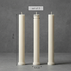 Three white candles of different heights on a gray background with measurements.