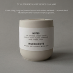 Candle with a label on a gray background