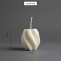 Small white candle with dimensions on a gray background
