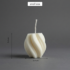 Small white candle with dimensions on a gray background