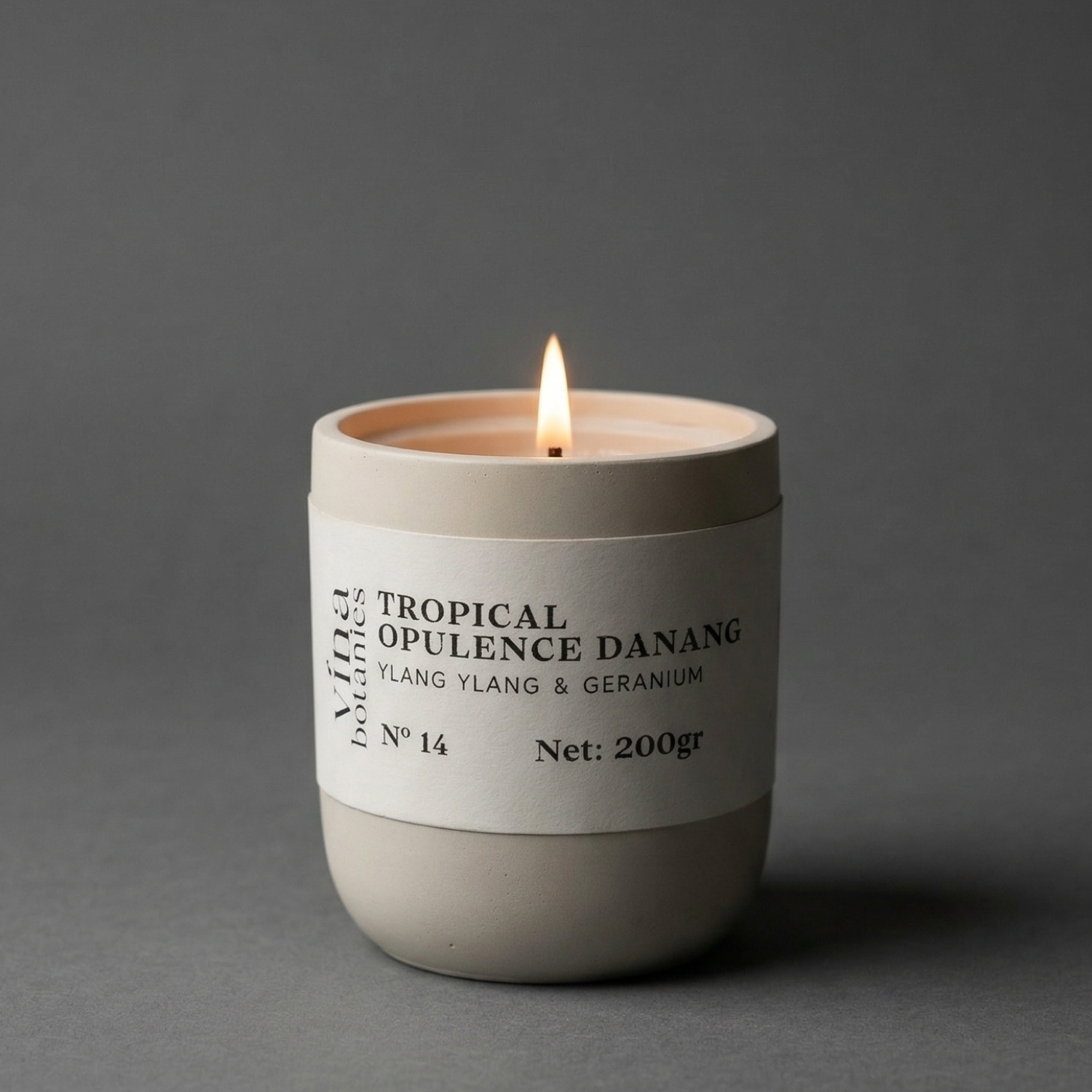 Candle with a label on a gray background