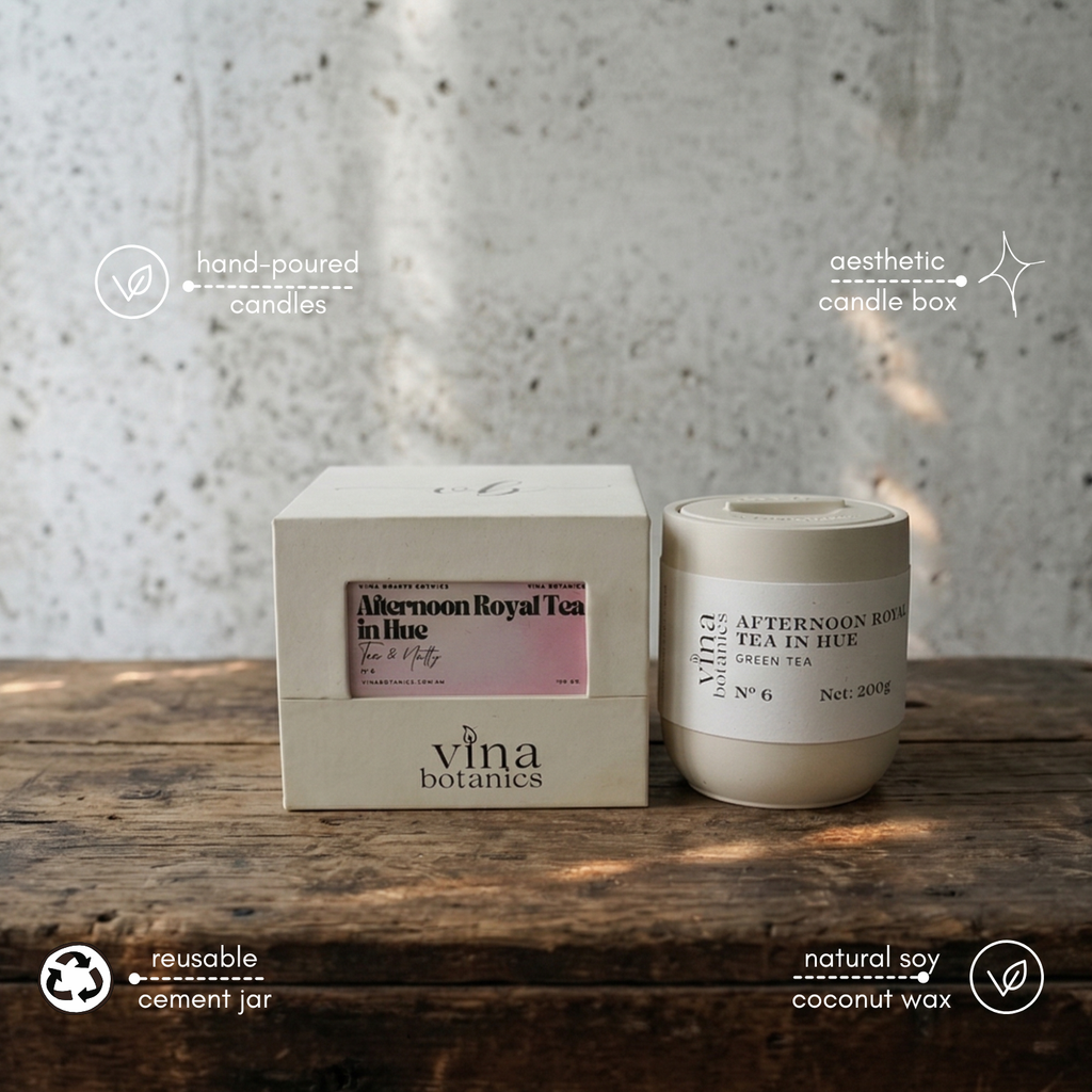 Vina Botanics candle and packaging on a wooden surface with a textured wall background