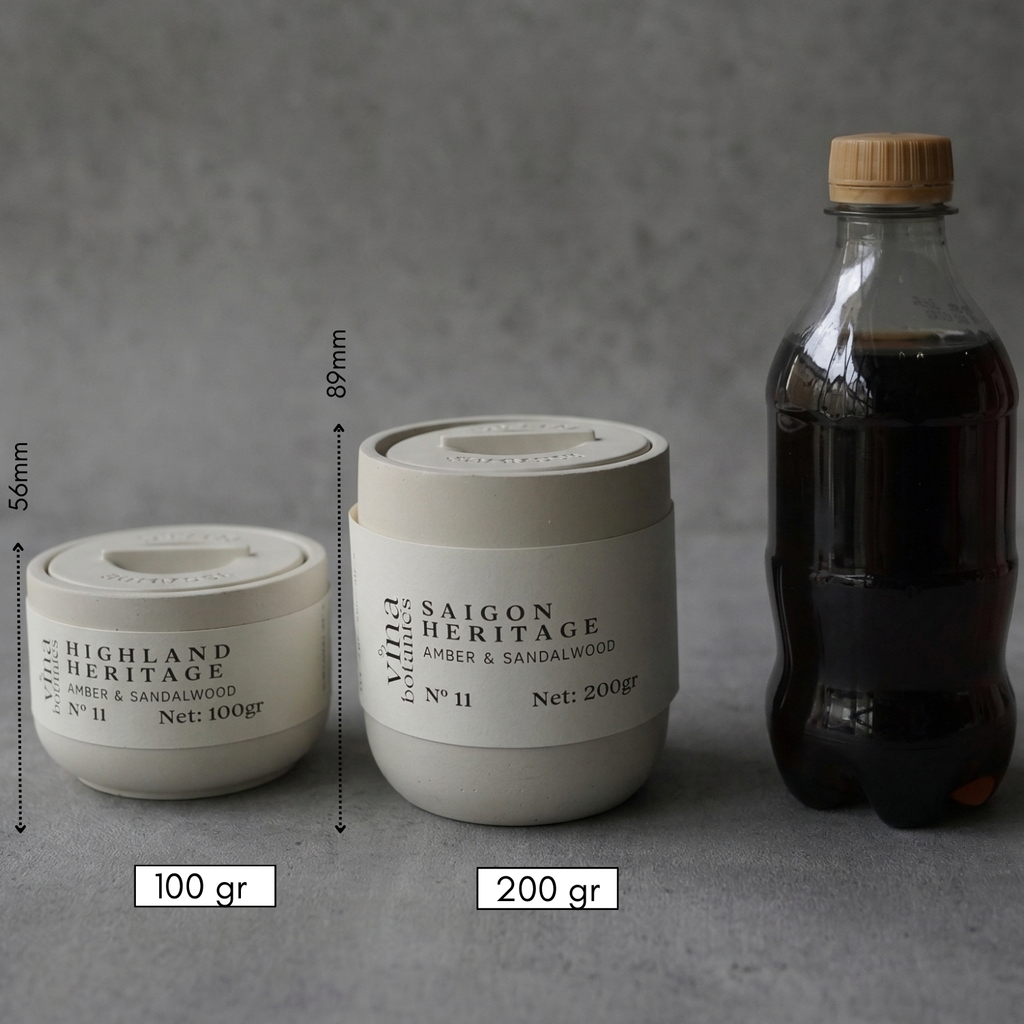 Two containers labeled 'Highland Heritage' and 'Saigon Heritage' with measurements and a bottle of liquid on a gray background.